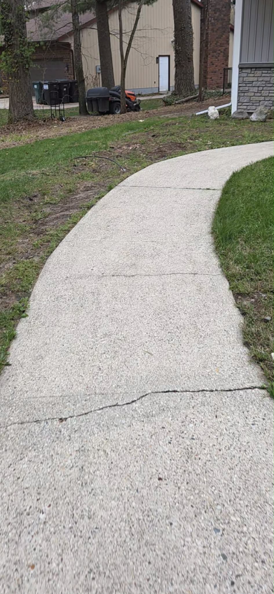 Clean concrete walkway after professional power washing in Muskegon MI